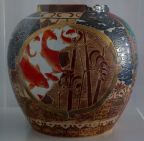 Large circular ceramic pot with Chinese artwork painted