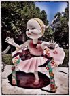 picture of sculpture of girl wearing pink dress in Canberra city