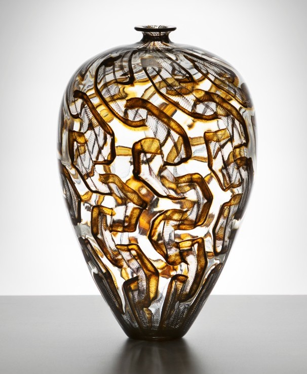 tall oval shaped glass vase with brown wave patens all over vase