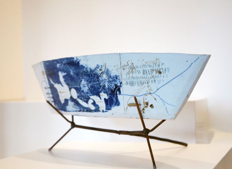 porcelain sculpture shaped like a boat with plans for ACT painted ontop