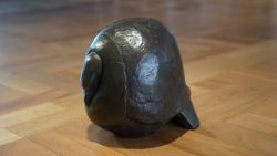 Bronze sculpture of a round pigeon