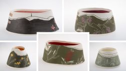 2 ceramic pots with native flowers sketched into them