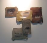 5 blown glass panels arranged in an upside down pyriamid (irregular) with faded painted scenes on each one, as if too mimic a memory