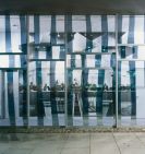 Photograph of the outside of the ACT Assembly sohwing the Cameral artwork which features MLAs behind a mirrored wall