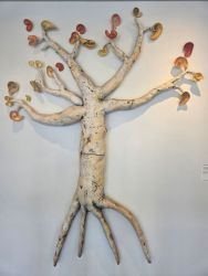 clay sculpture of tree with ears for leaves