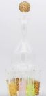 Glass decanter with 5 colour vials surrounding the base